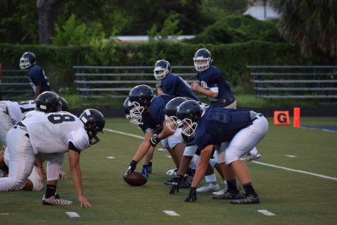 The Buttons' offensive line gets ready to begin an attack against the Edison defense.